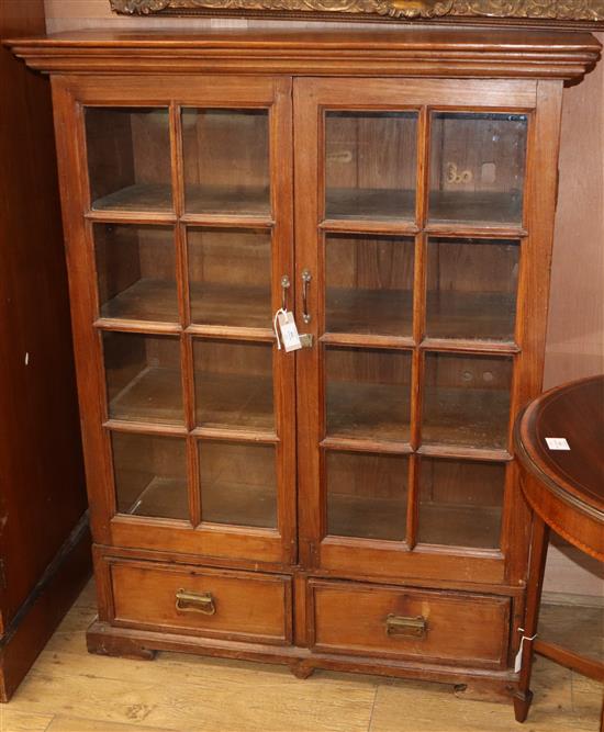 A Continental glazed teak two drawer bookcase W.102cm